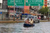 In 2011, a flooded street in Thailand became a river, forcing some residents to use boats to travel. Photo by ebvImages/Flickr