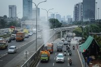 A Jakarta Environmental Agency mist cannon truck passes along Jl. TB Simatupang in South Jakarta on Sept. 19