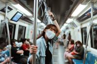Woman in face mask on subway. Photo by Ketut Subiyanto/Pexels