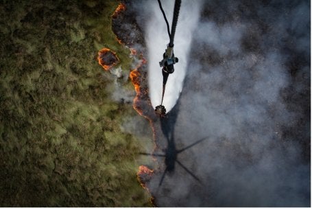Figure 1. Aerial firefighting operation during a forest and land fire event (photo credit: Nopri Ismi/People for Peat)