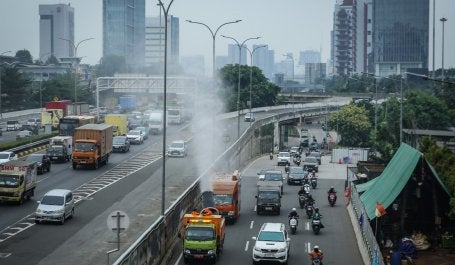 A Jakarta Environmental Agency mist cannon truck passes along Jl. TB Simatupang in South Jakarta on Sept. 19