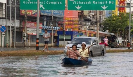 In 2011, a flooded street in Thailand became a river, forcing some residents to use boats to travel. Photo by ebvImages/Flickr