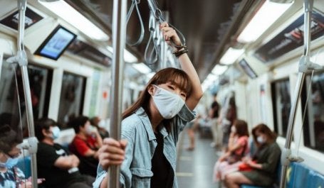 Woman in face mask on subway. Photo by Ketut Subiyanto/Pexels