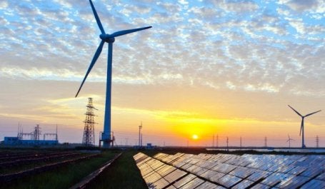 Solar panels and wind turbines. Photo by Kenueone/Pixabay